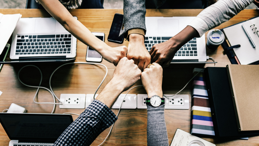 colleagues-giving-fist-bump